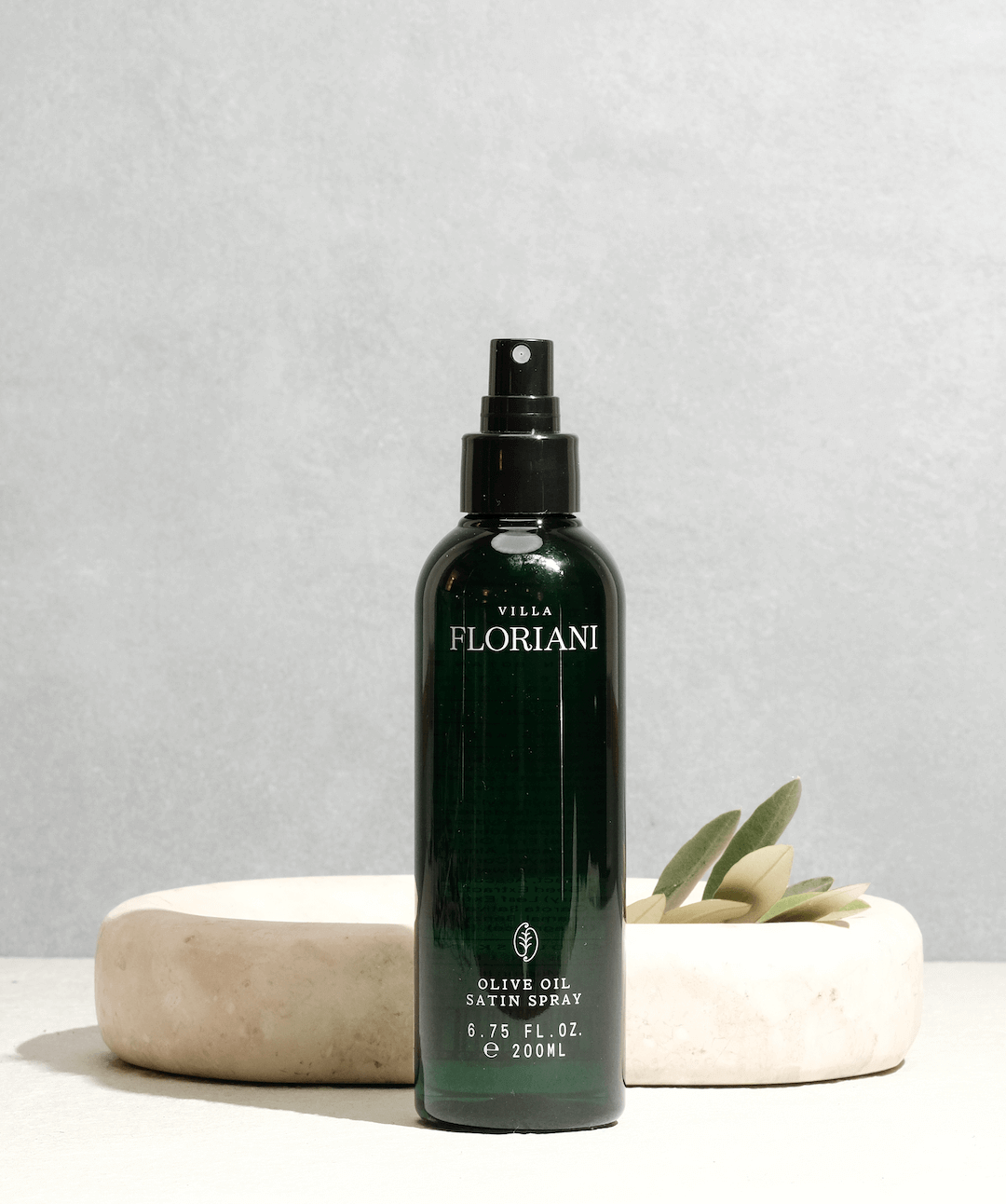 Villa Floriani Italian cold pressed olive oil spray with olive leaves a natural moisturizing body oil spray.